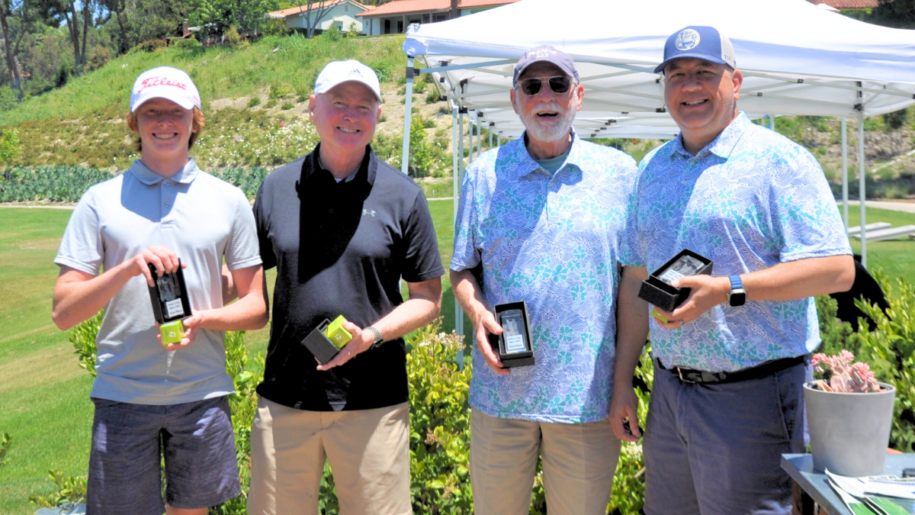 men holding trophies